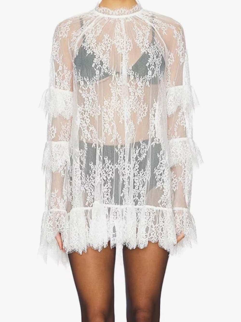 Elegant sheer white lace dress Long sleeves and scalloped hem add feminine charm